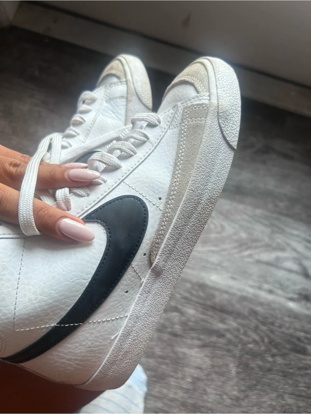 Nike White High-Top Sneakers with Black Swoosh and Pink Tongue Logo